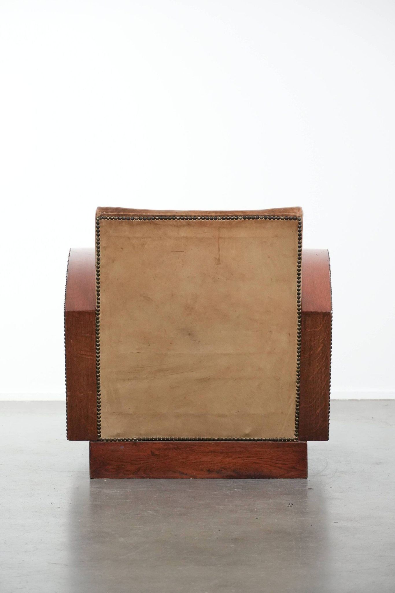 Art Deco design armchair in light cognac cowhide leather.