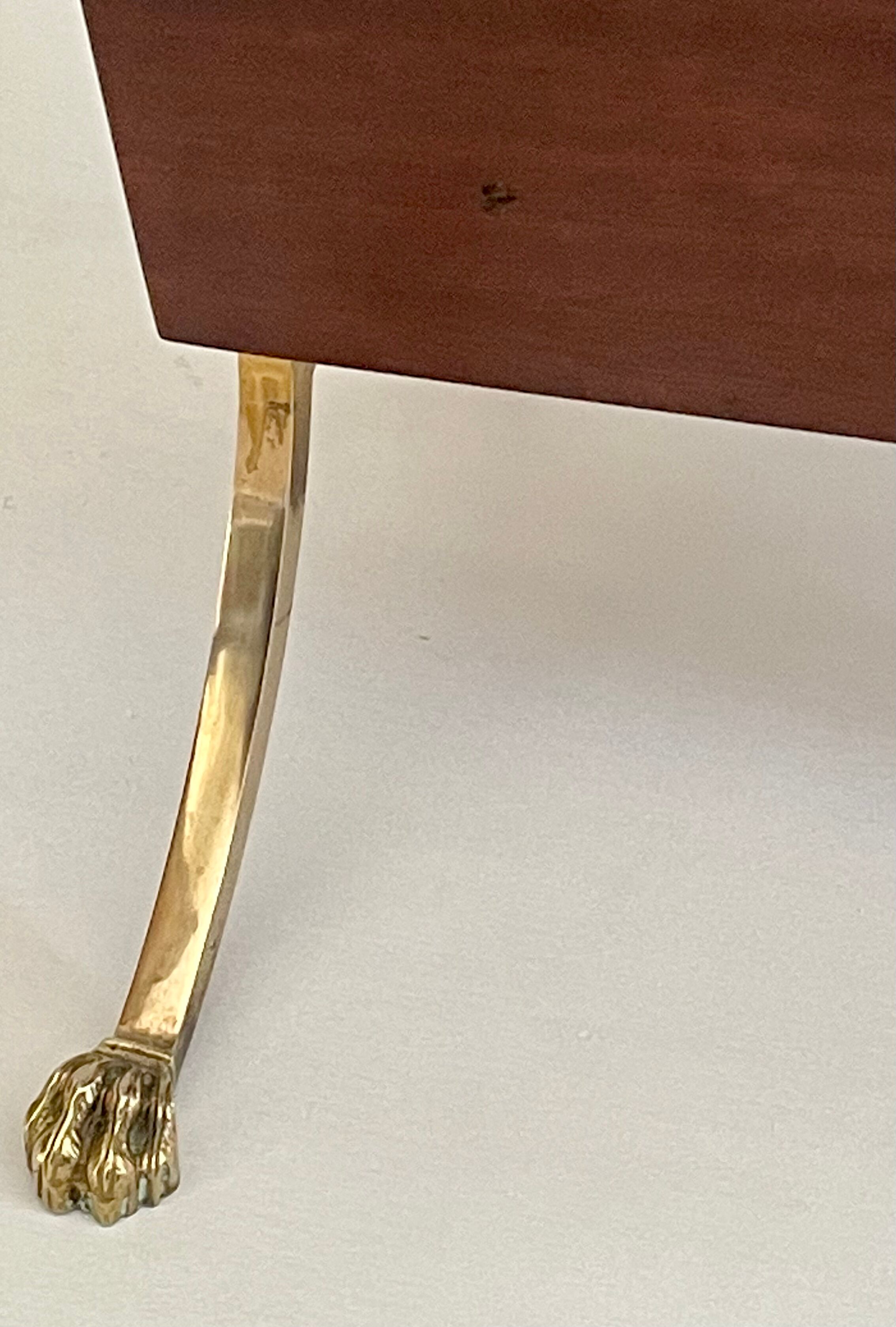 Magazine racks with claw feet by Maison Jansen