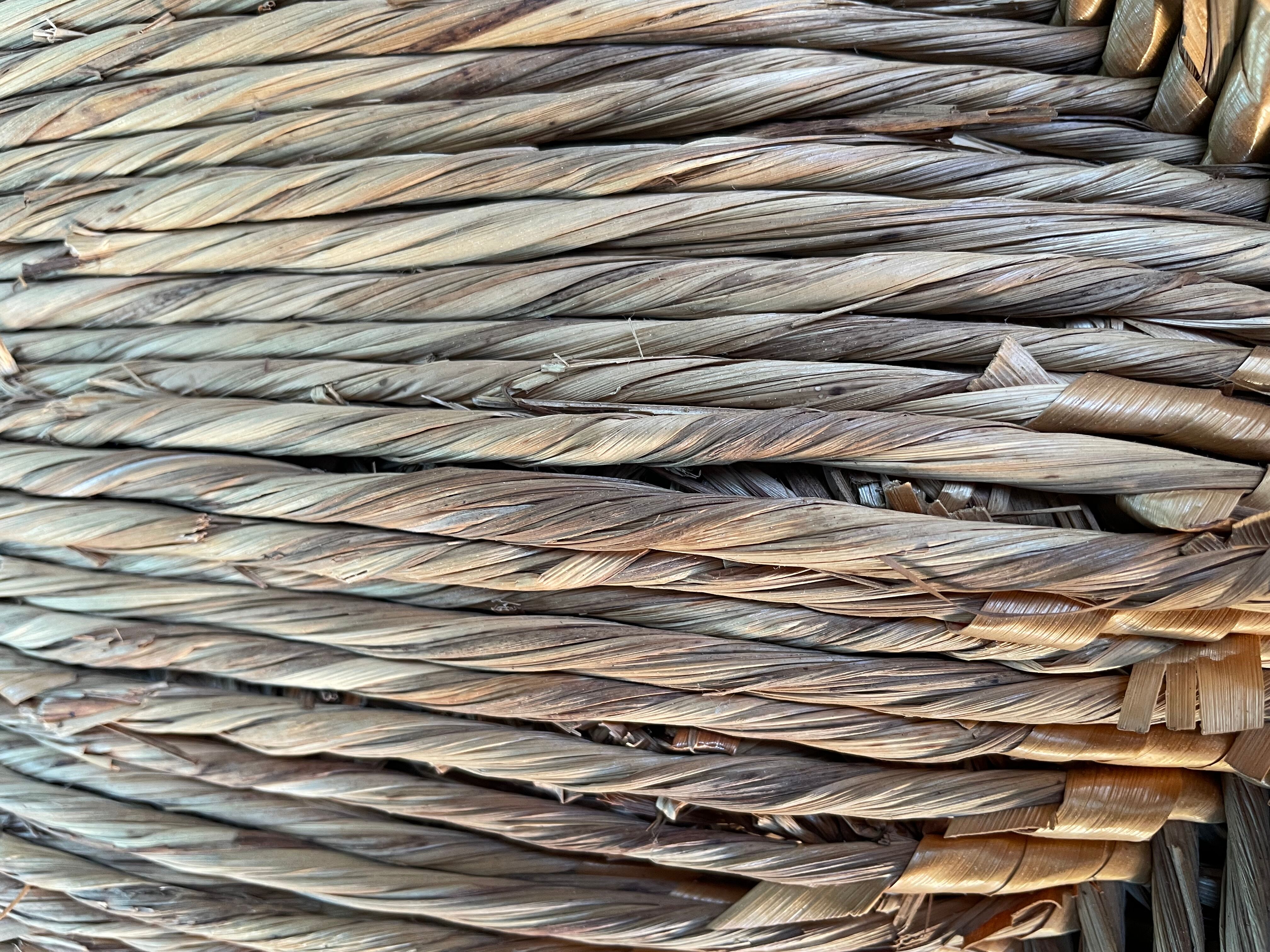 Vintage armchair in straw and brutalist wood