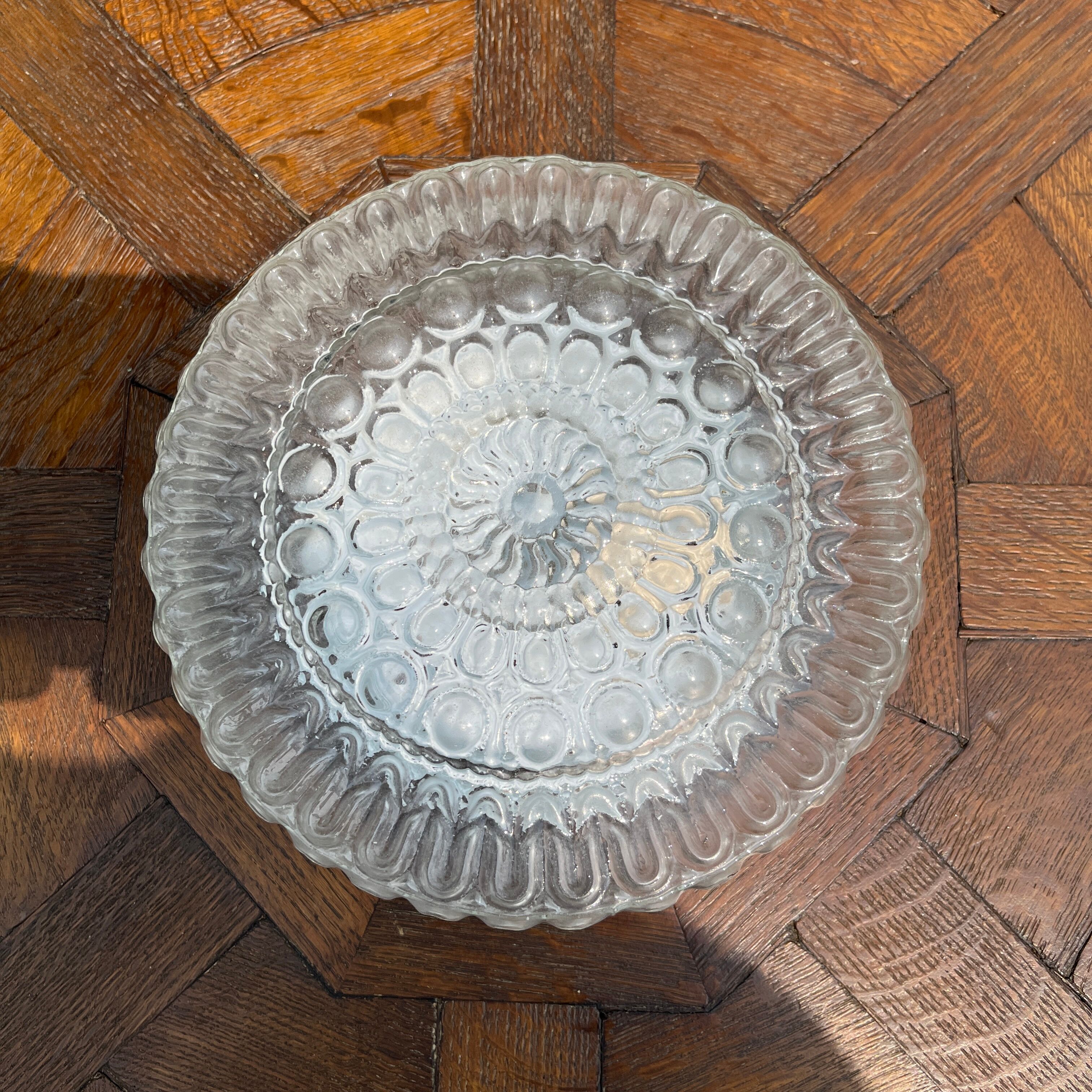 Cast glass ceiling lamp with relief