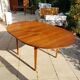 Round extendable teak dining table from the 60s