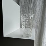 Glass vase with stylized flower pattern