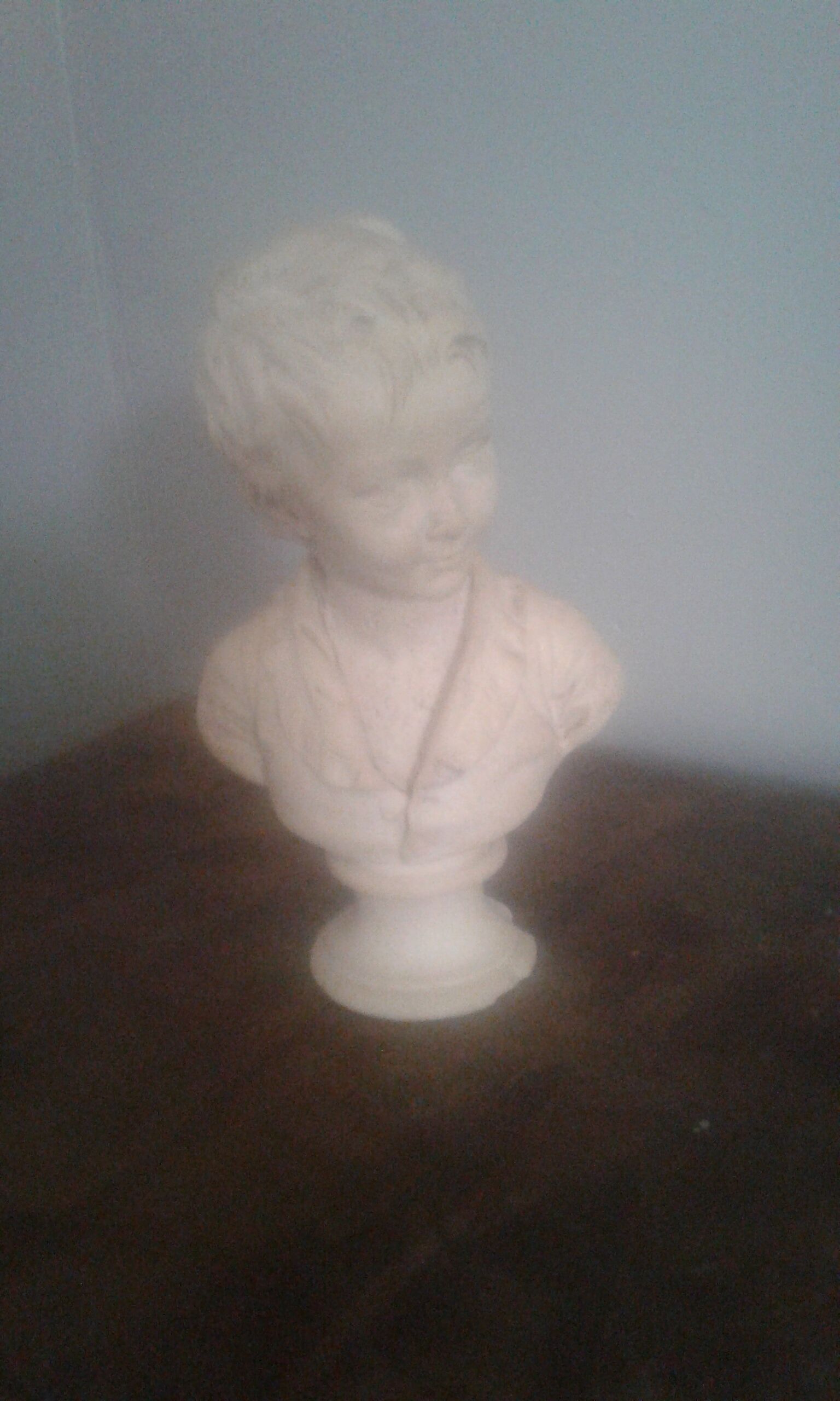 Boy bust in plaster