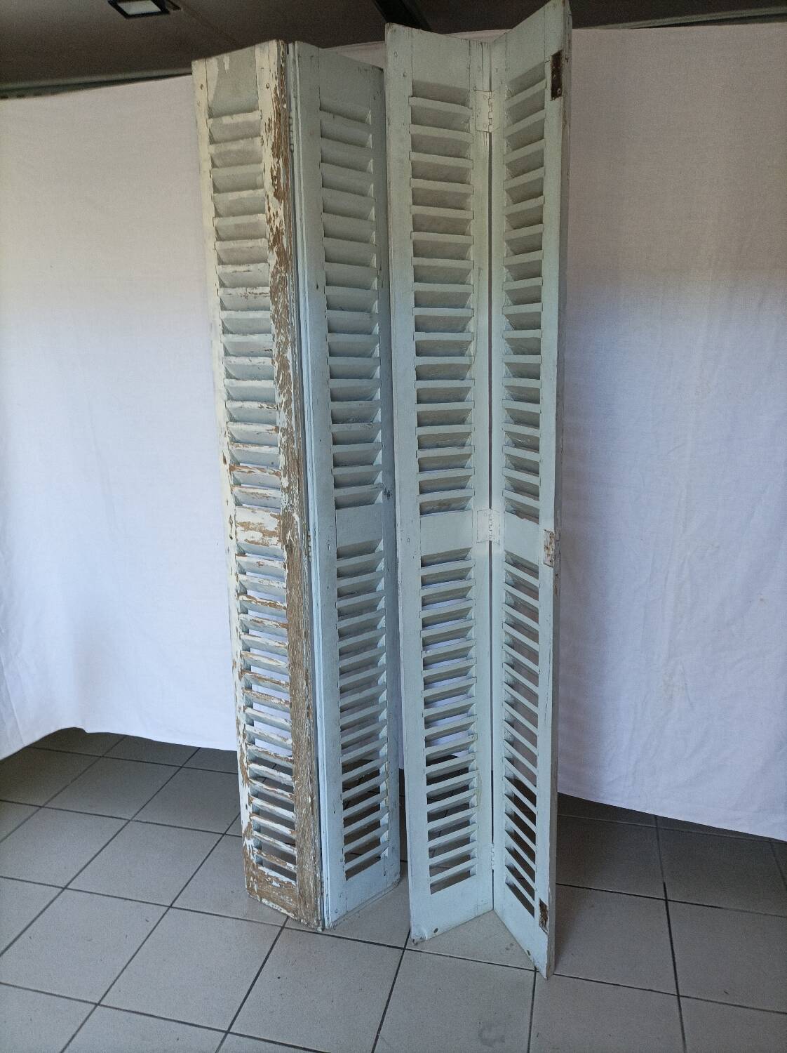 Louvered wooden shutter