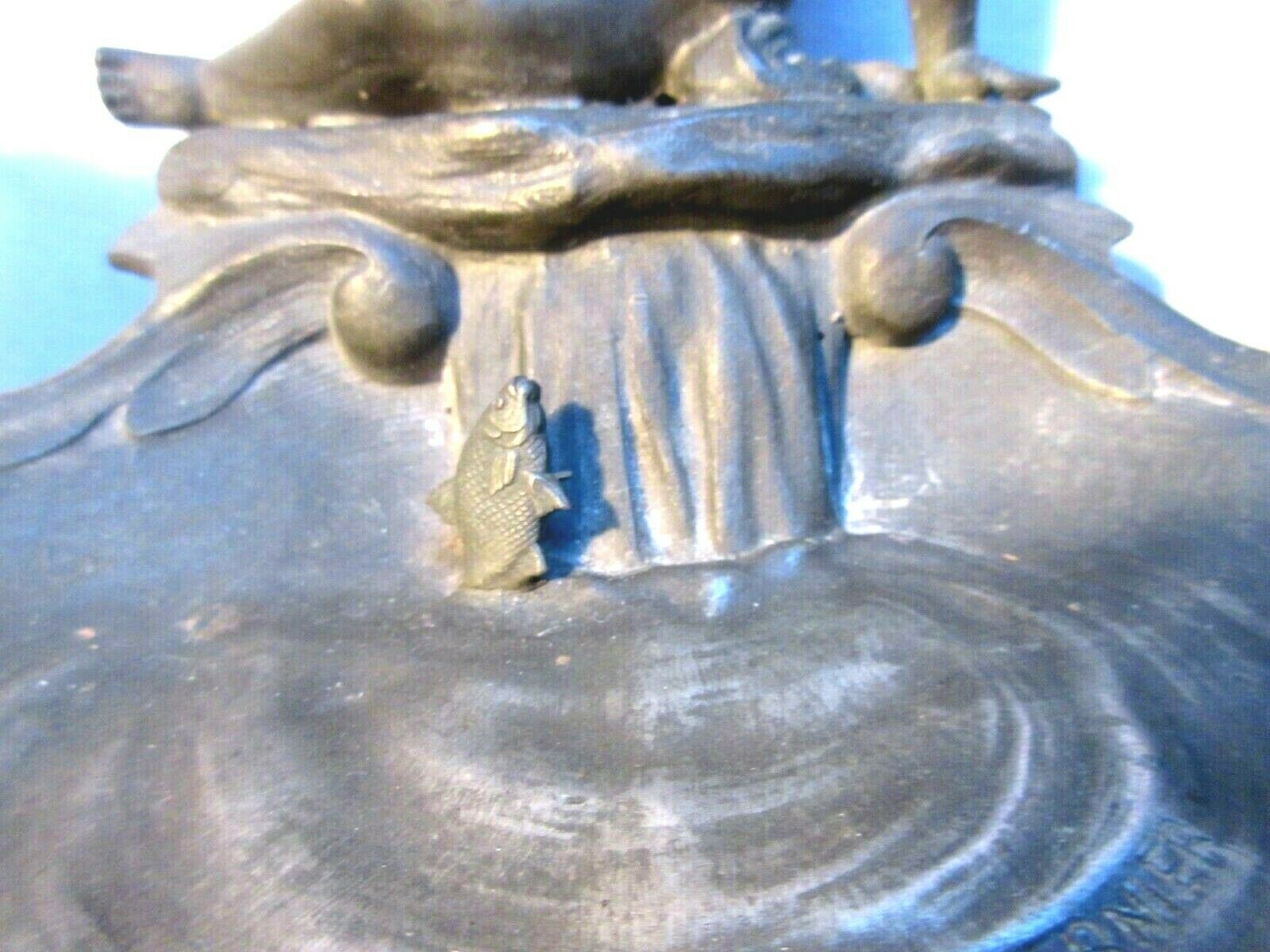 Double ink out 19th in tin signed J. GARNIER: The Cherub fisherman