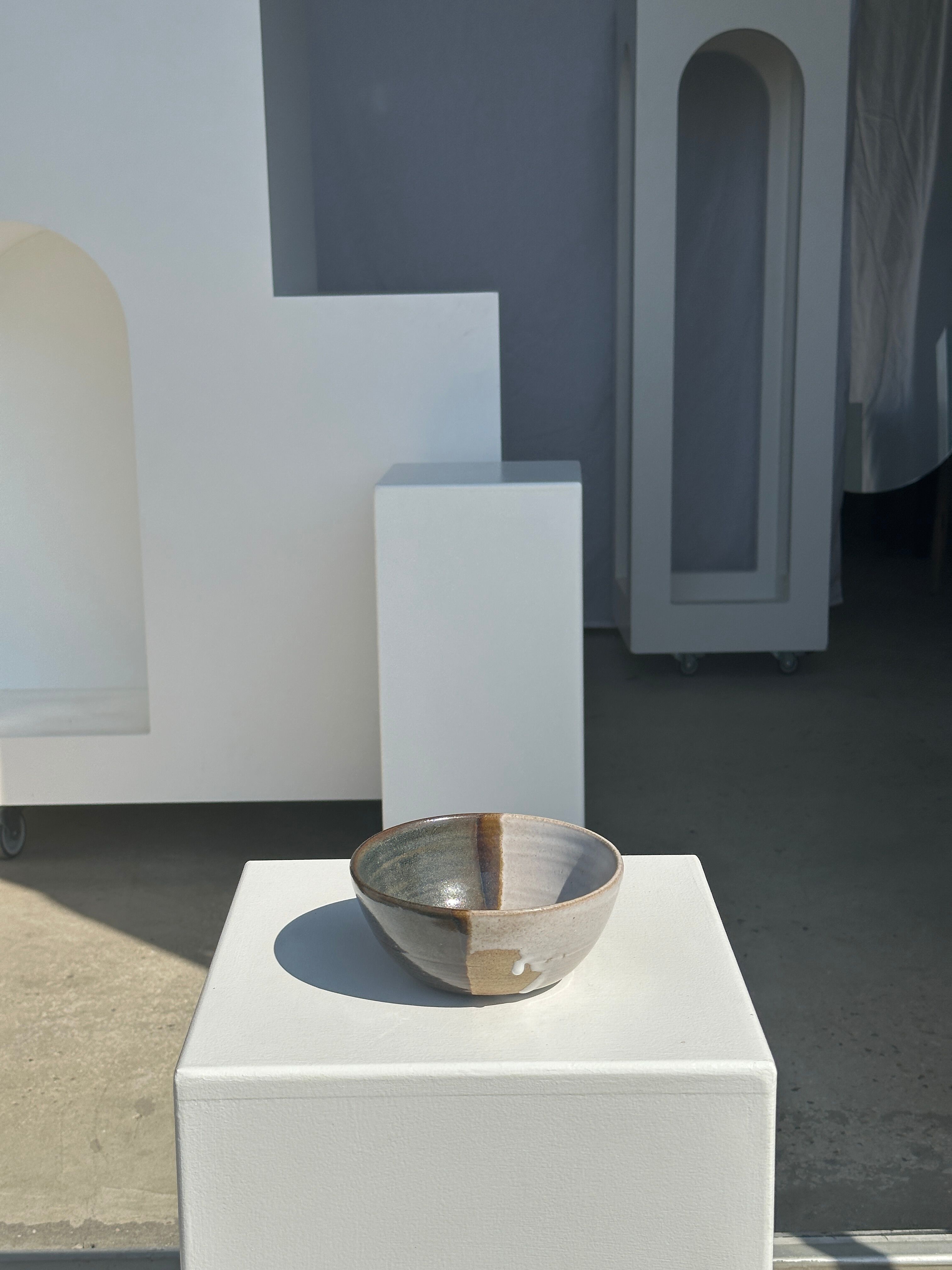 White and glossy brown two-tone ceramic bowl, matt earth