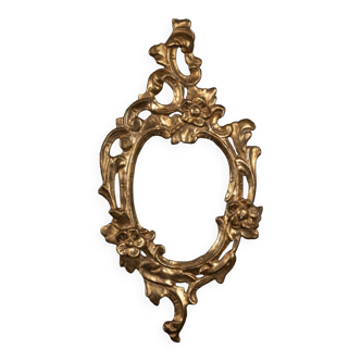 17th century frame in gilded wood with flower decoration