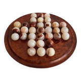 Solitaire game with stone balls