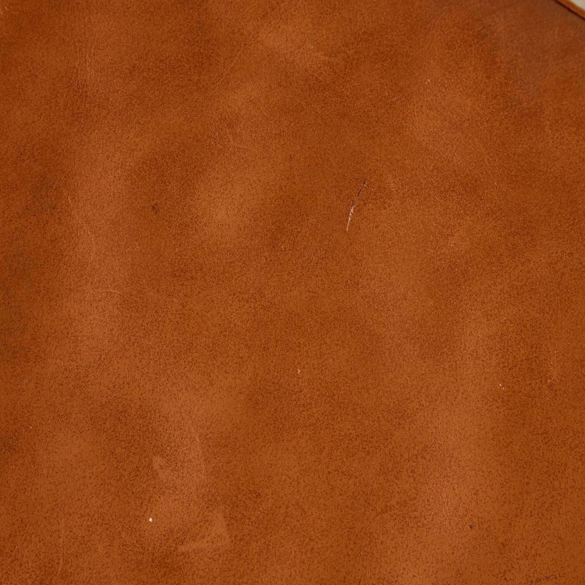 Ottoman with leather upholstery