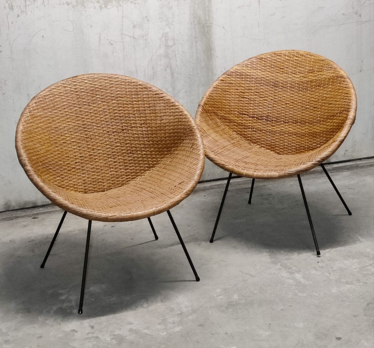 Pair of braided rattan armchairs