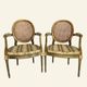 Pair of Louis XVI style armchairs, oval backrest and caning.