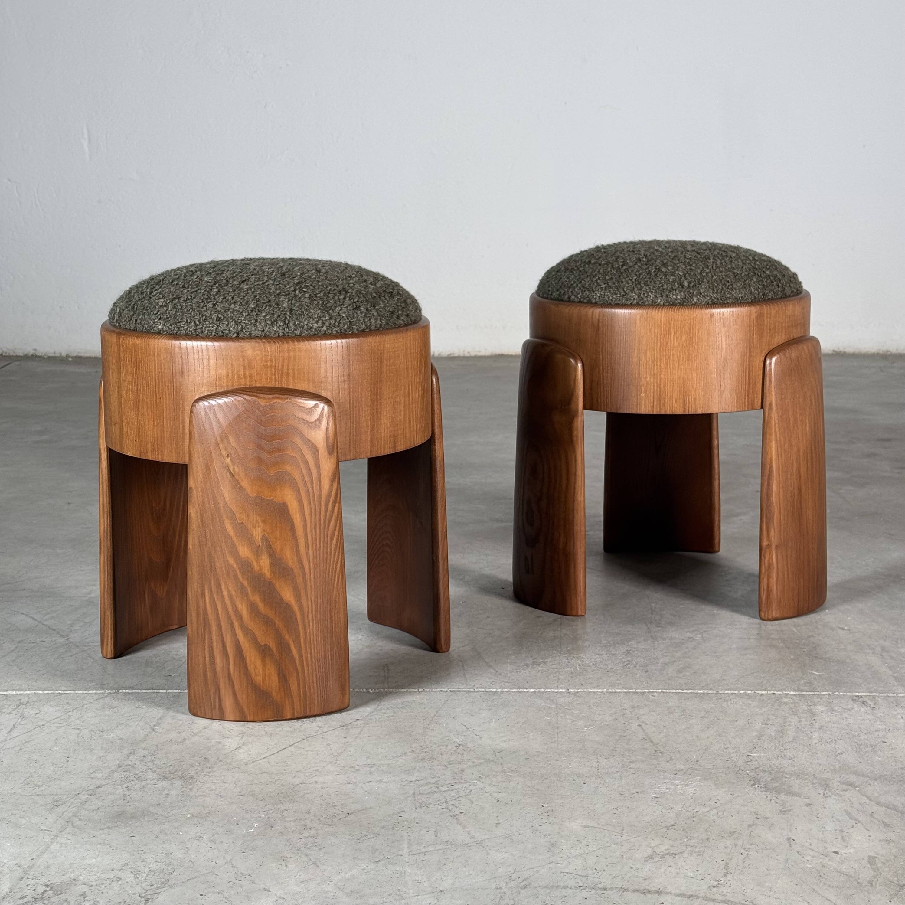 Sculptural pair of ash wood stools with dedar milano bouclé