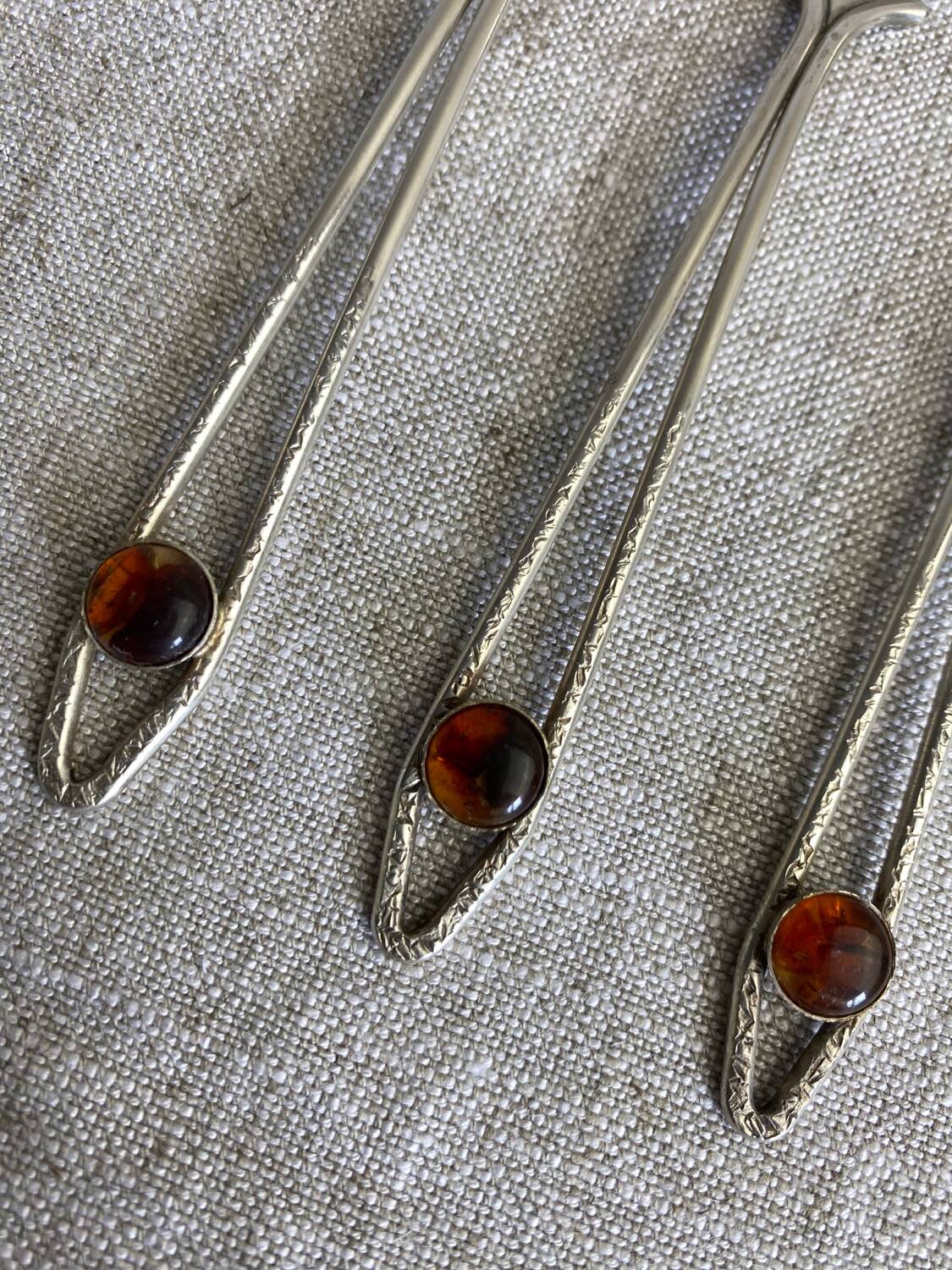 Art Nouveau metal and amber spoons
