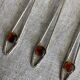 Art Nouveau metal and amber spoons