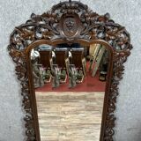 Very important Black Forest mirror in molded and carved wood