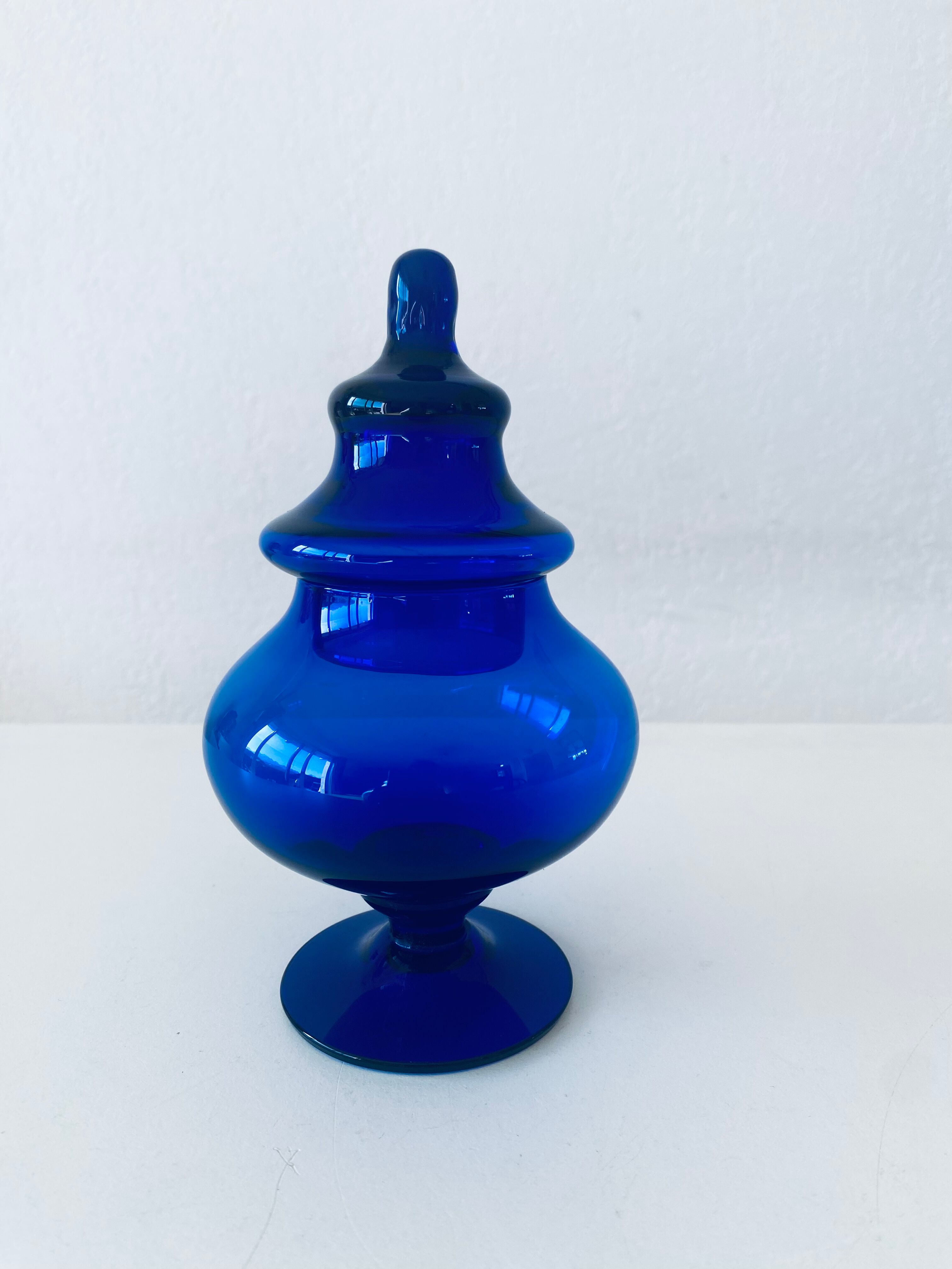 Blue glass apothecary shaped bottle