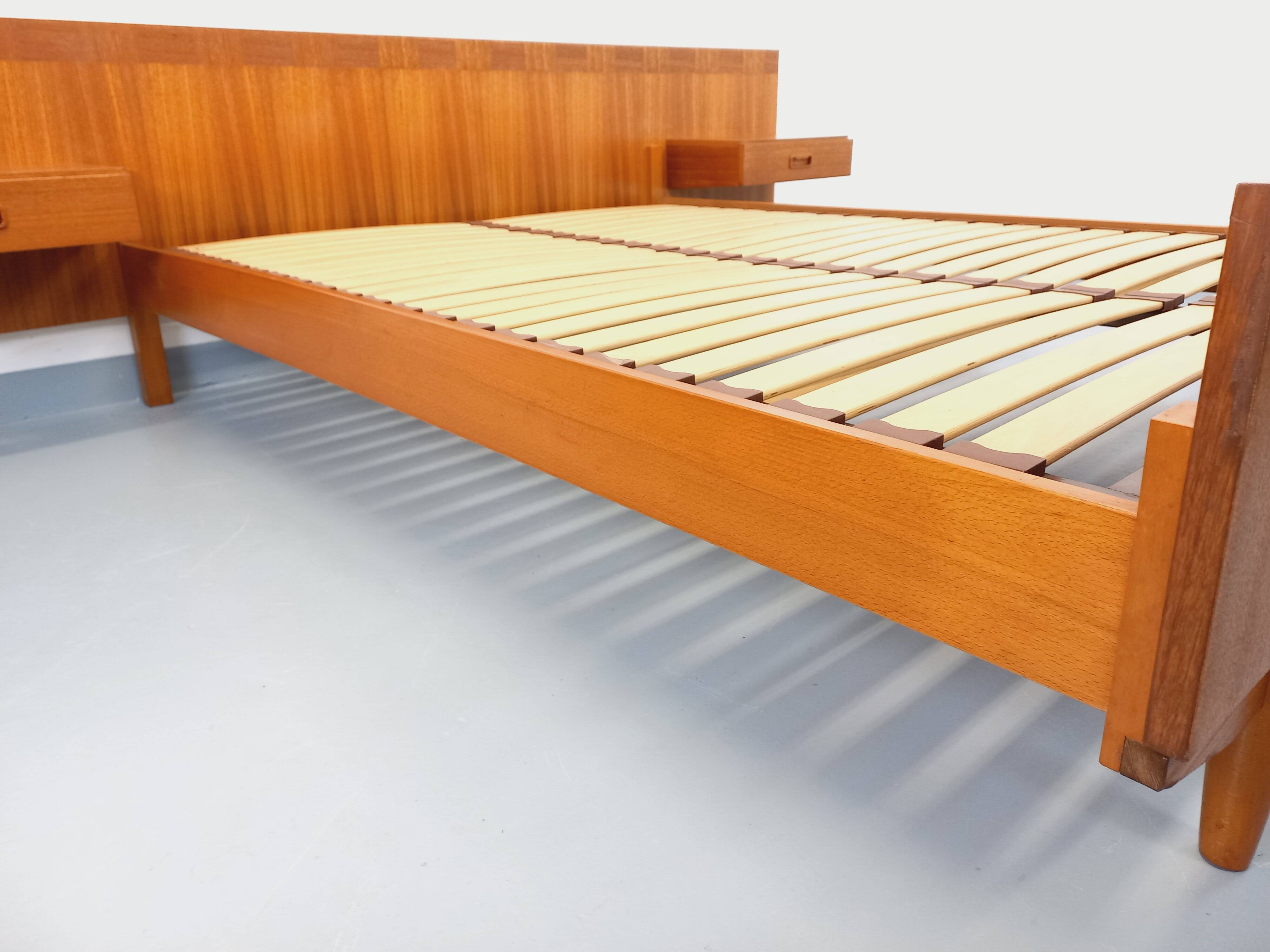 Double bed vintage Scandinavian in teak from the 1960s with integrated bedside tables.