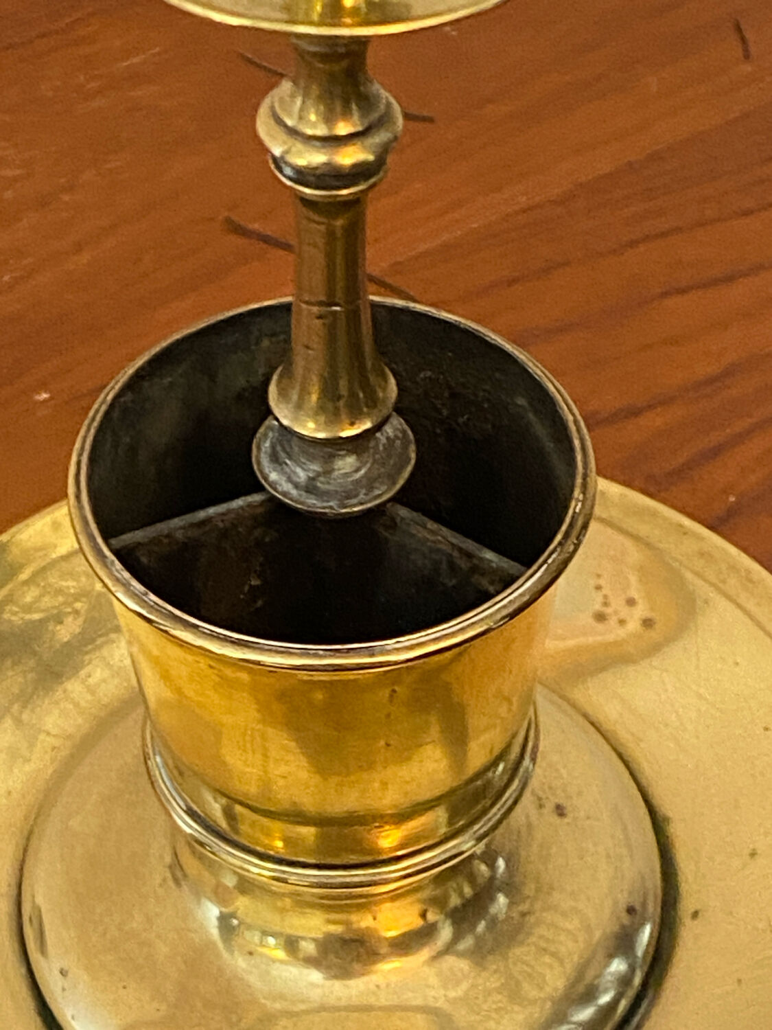 Compartmentalised brass candlestick
