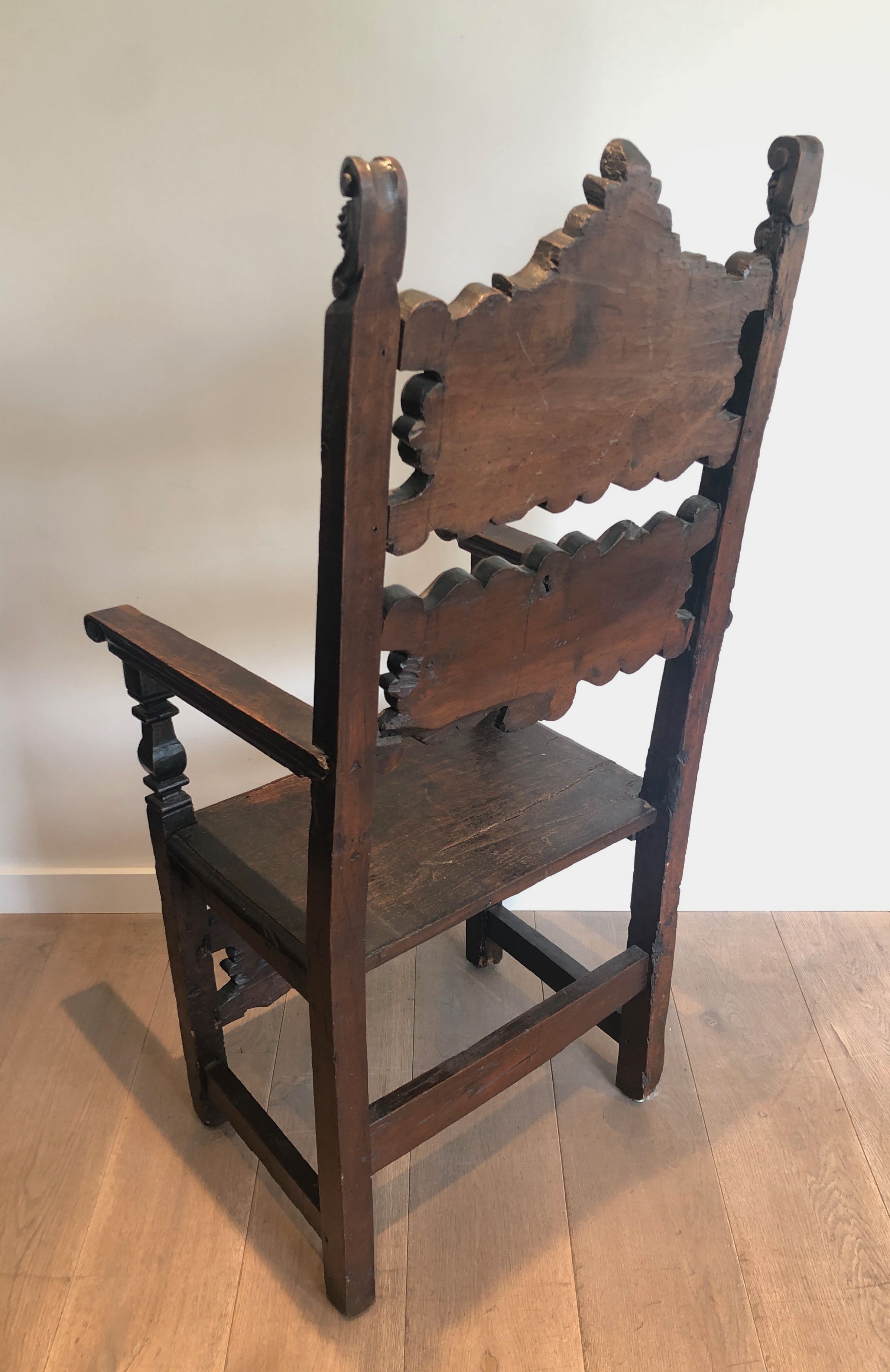 Set of an armchair and a pair of chairs in Italian Renaissance walnut