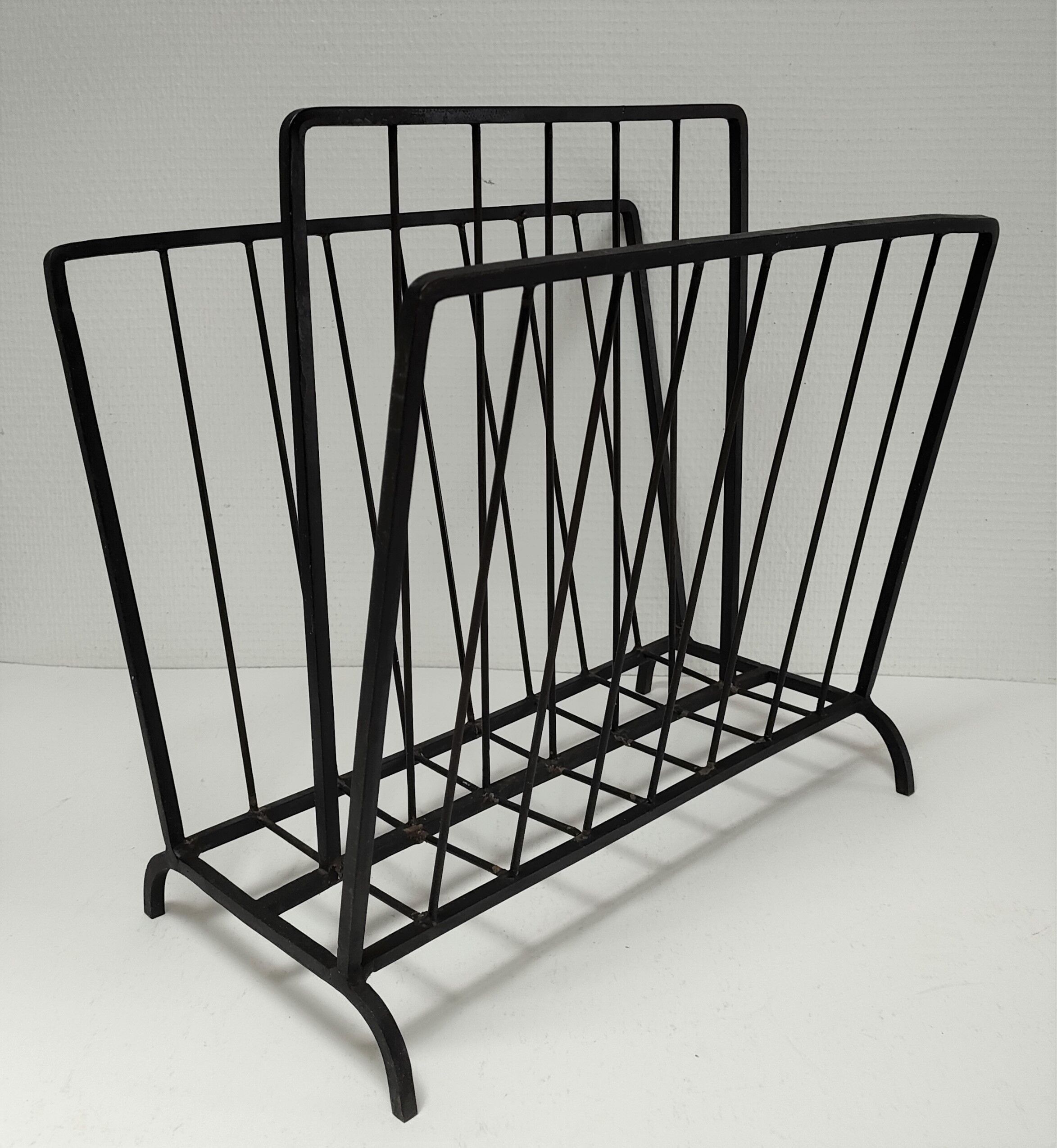 Modernist magazine holder black iron 60s