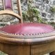 Pair of studded burgundy leather Art Deco chairs