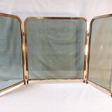 Vintage fireplace screen in smoked glass and gold-tone metal