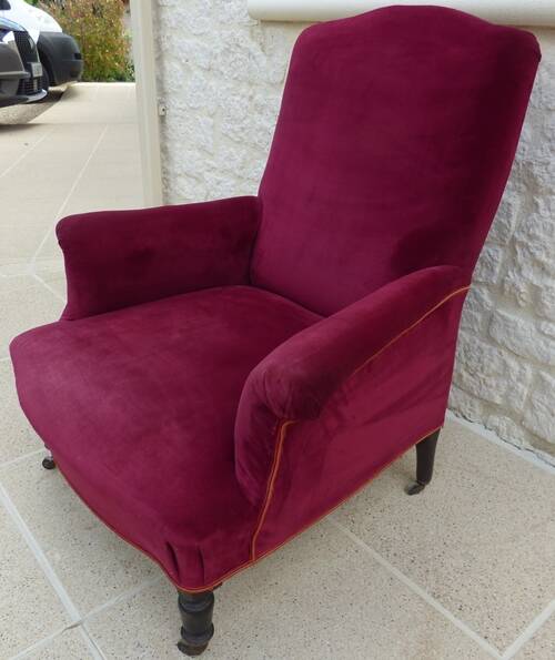 Bergère with blackened wooden legs on casters, Napoleon III period, velvet upholstery