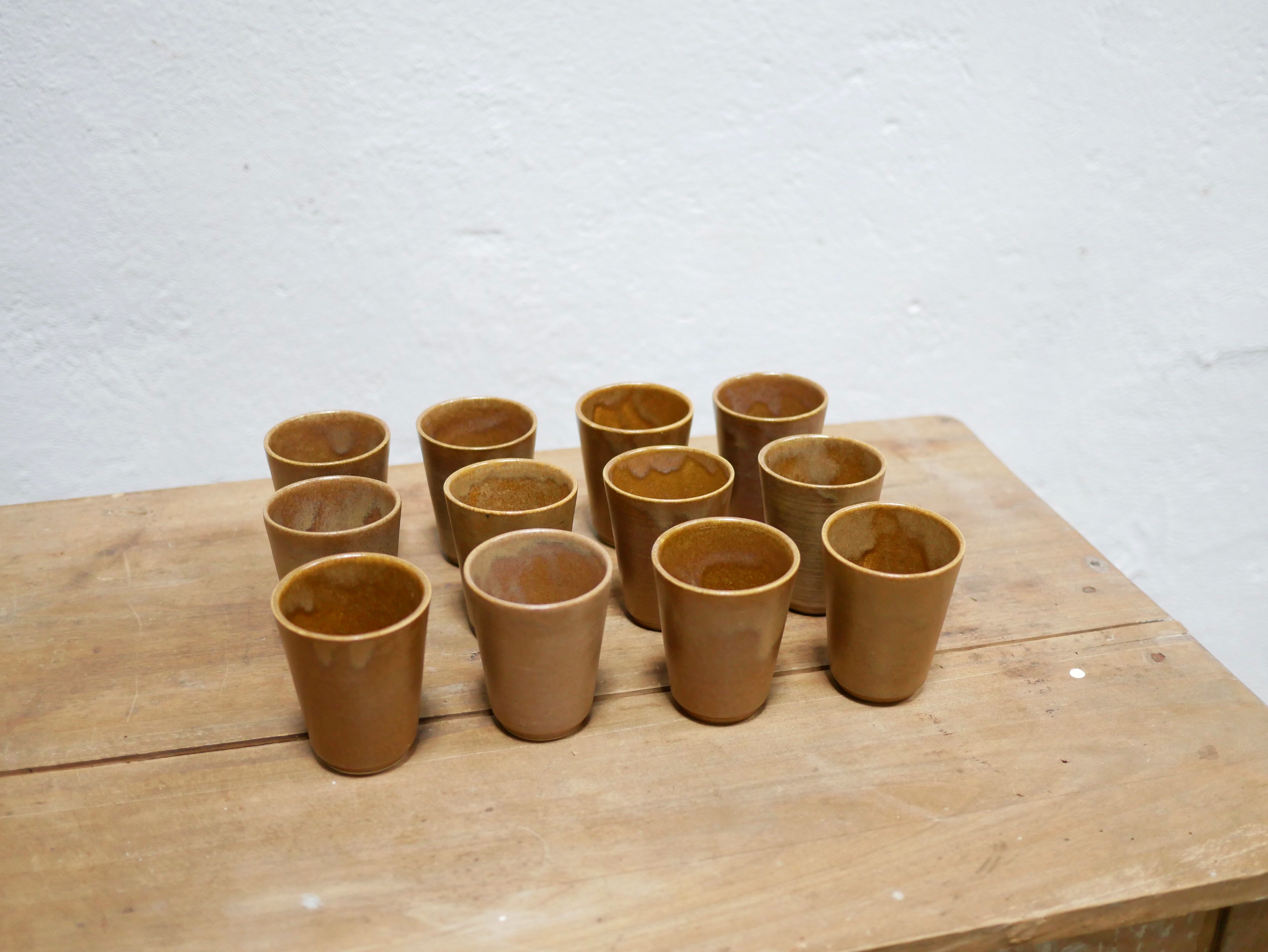 Series of 4 vintage stoneware glasses by the manufacture of Digoin, France