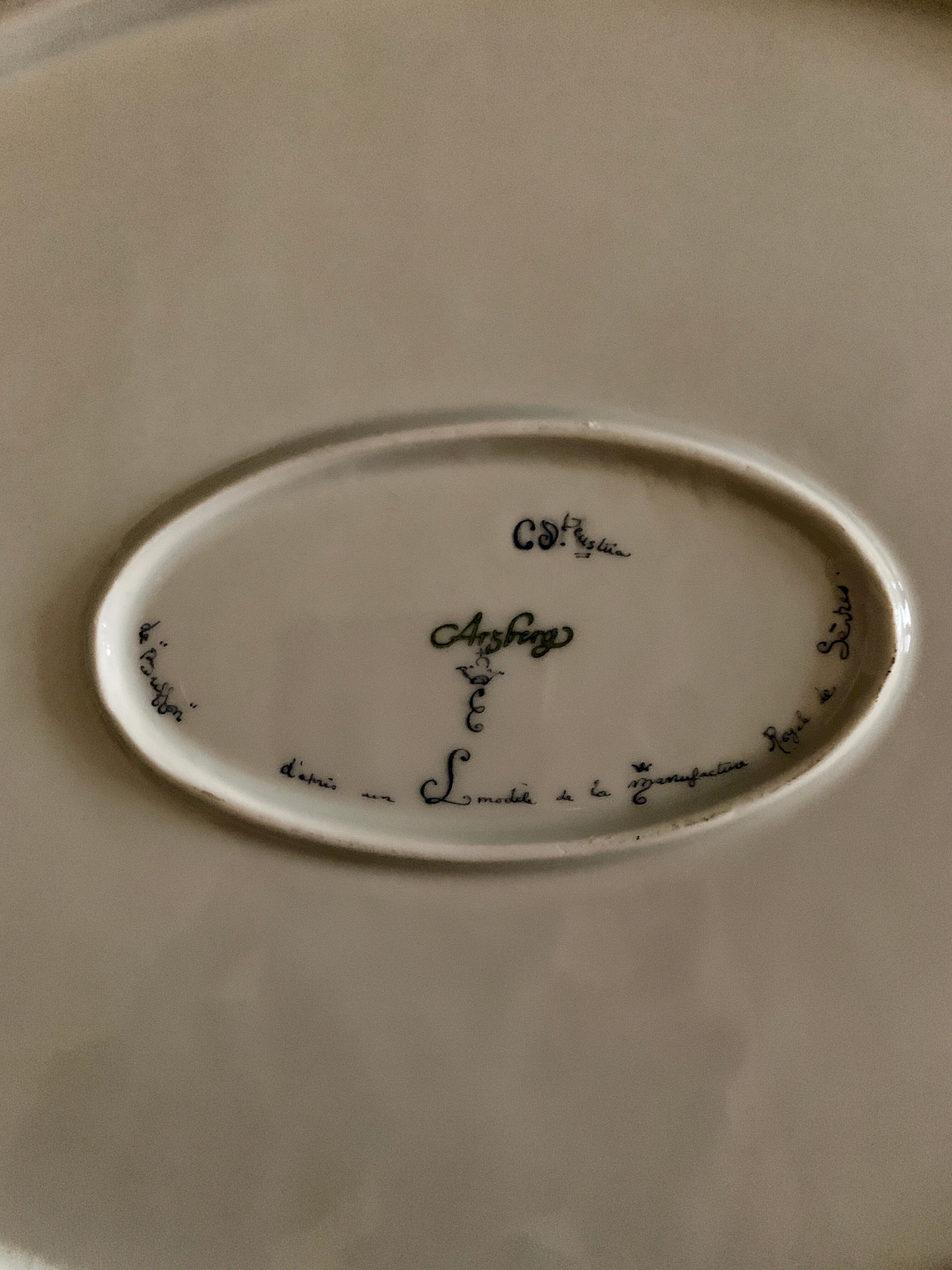 Plate signed Arsberg, "The Buffoon" after a model from the Royal Manufacture of Sèvres.