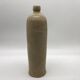 Old hot water bottle in glazed stoneware, beige color