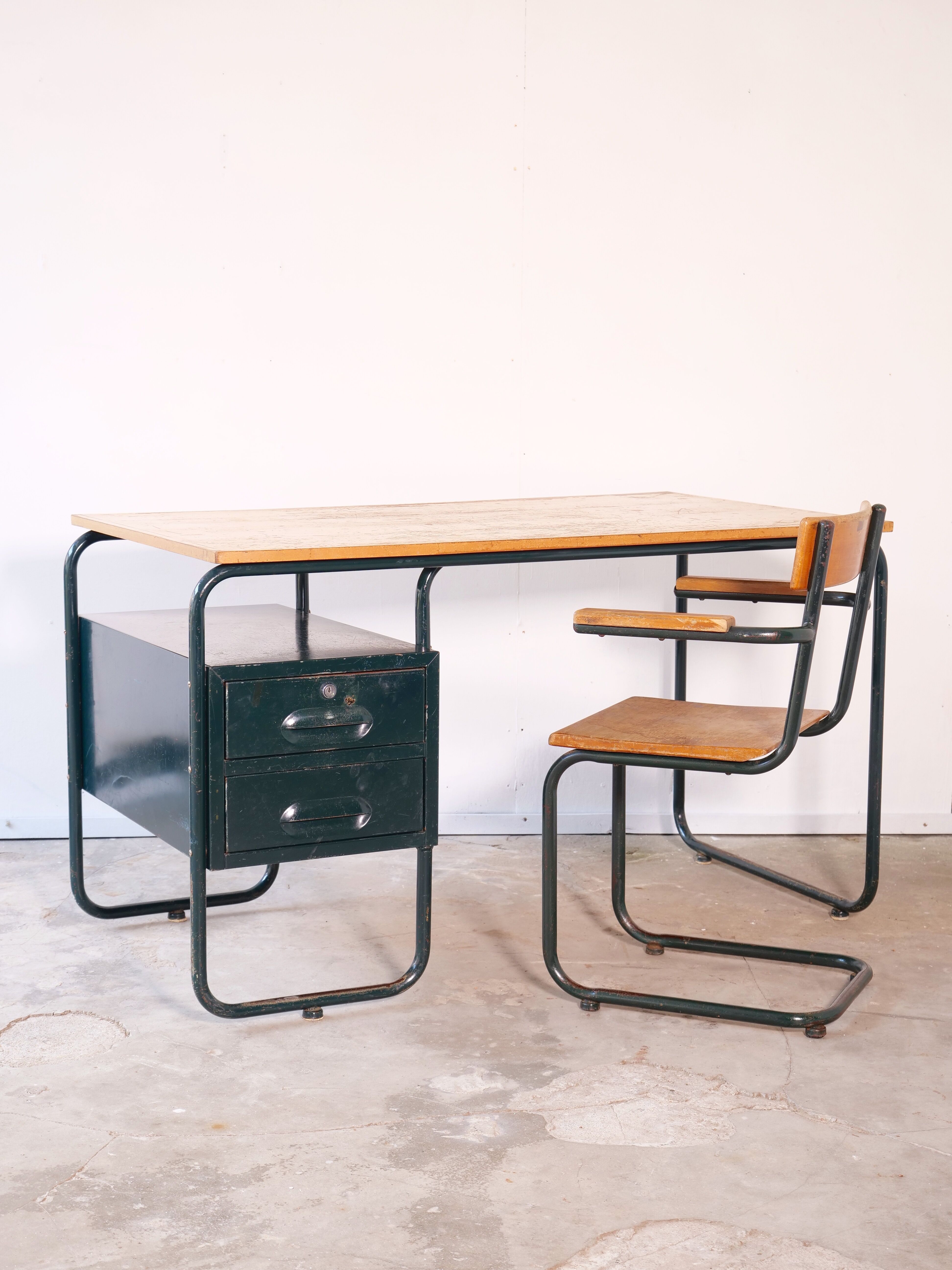 Desk with bauhaus style tubular steel chair