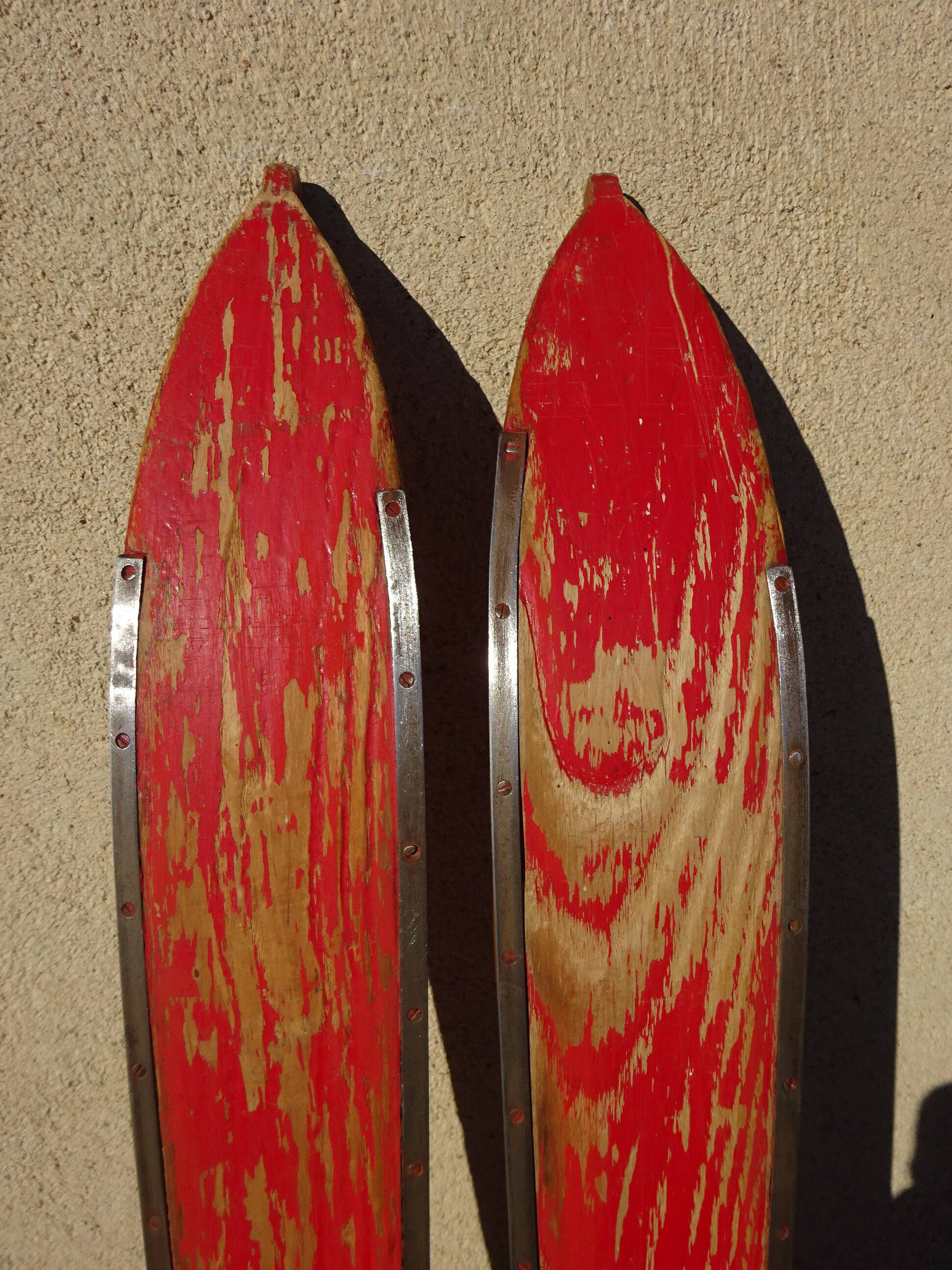 Pair of old wooden skis and metal bindings altiere