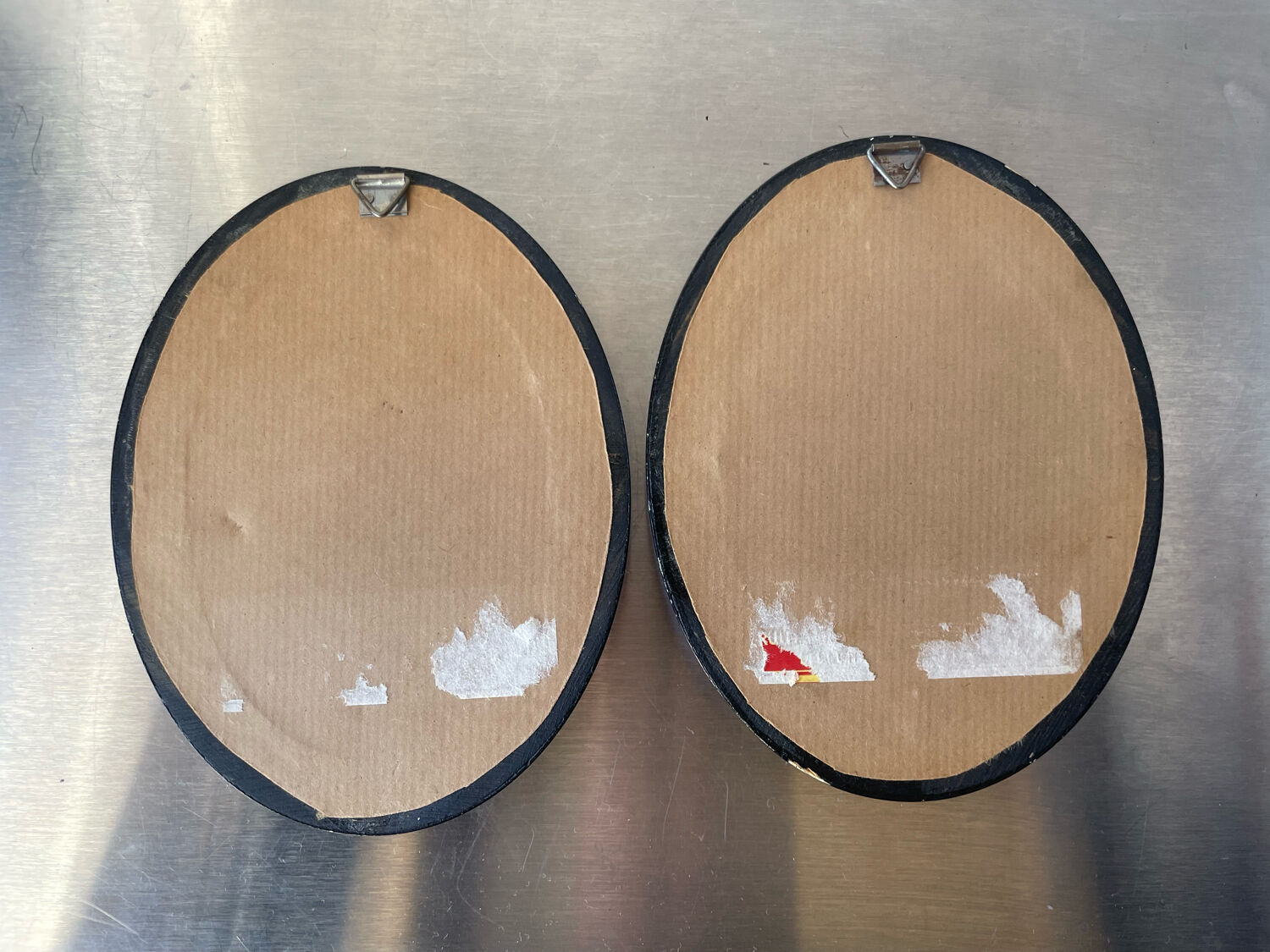 Pair of black wooden oval frames 1880’s  each 13 cm x 10 cm glass measurements 8.5 cm x 5.5 cm