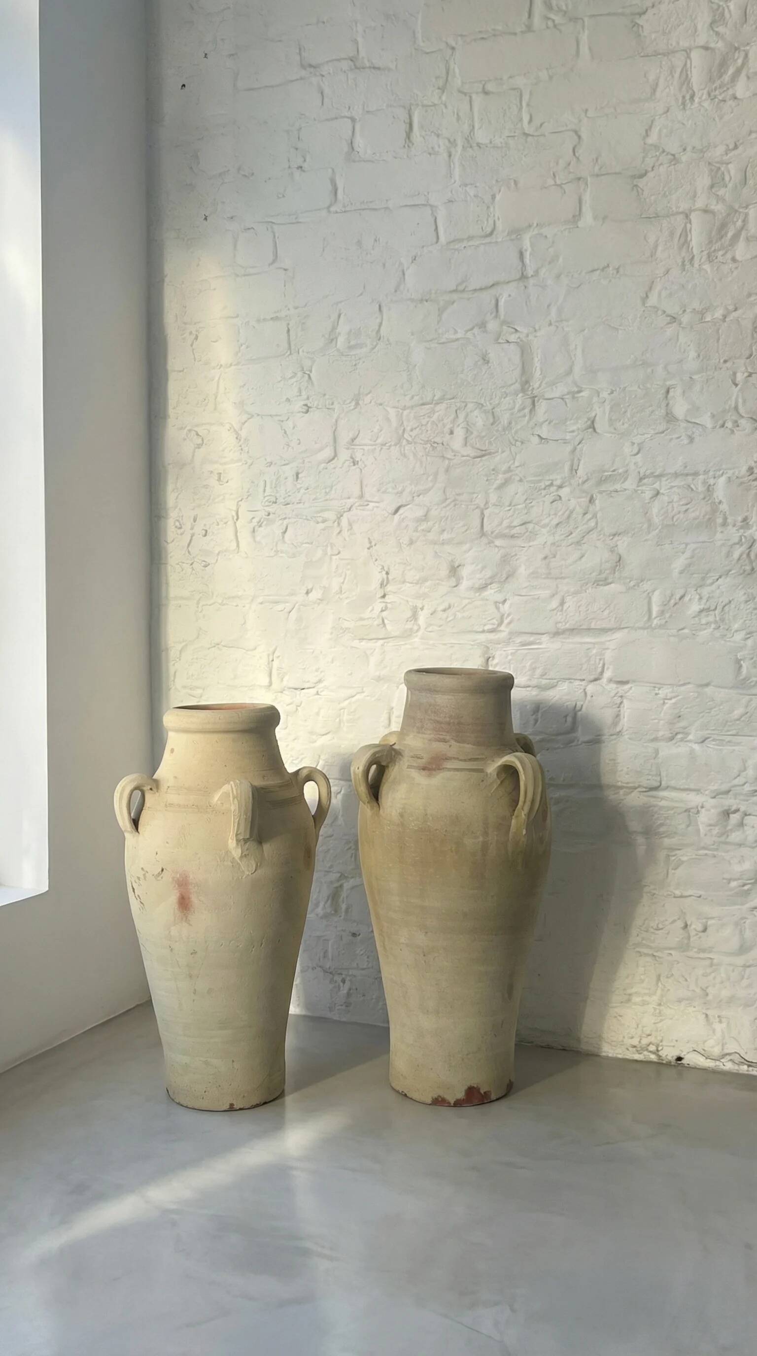 Pair of vintage terracotta amphorae