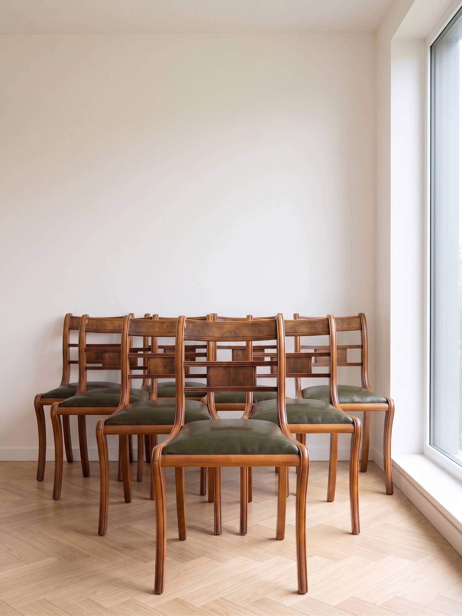 Set of 14 vintage chairs in solid wood and green leather.