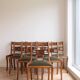 Set of 14 vintage chairs in solid wood and green leather.