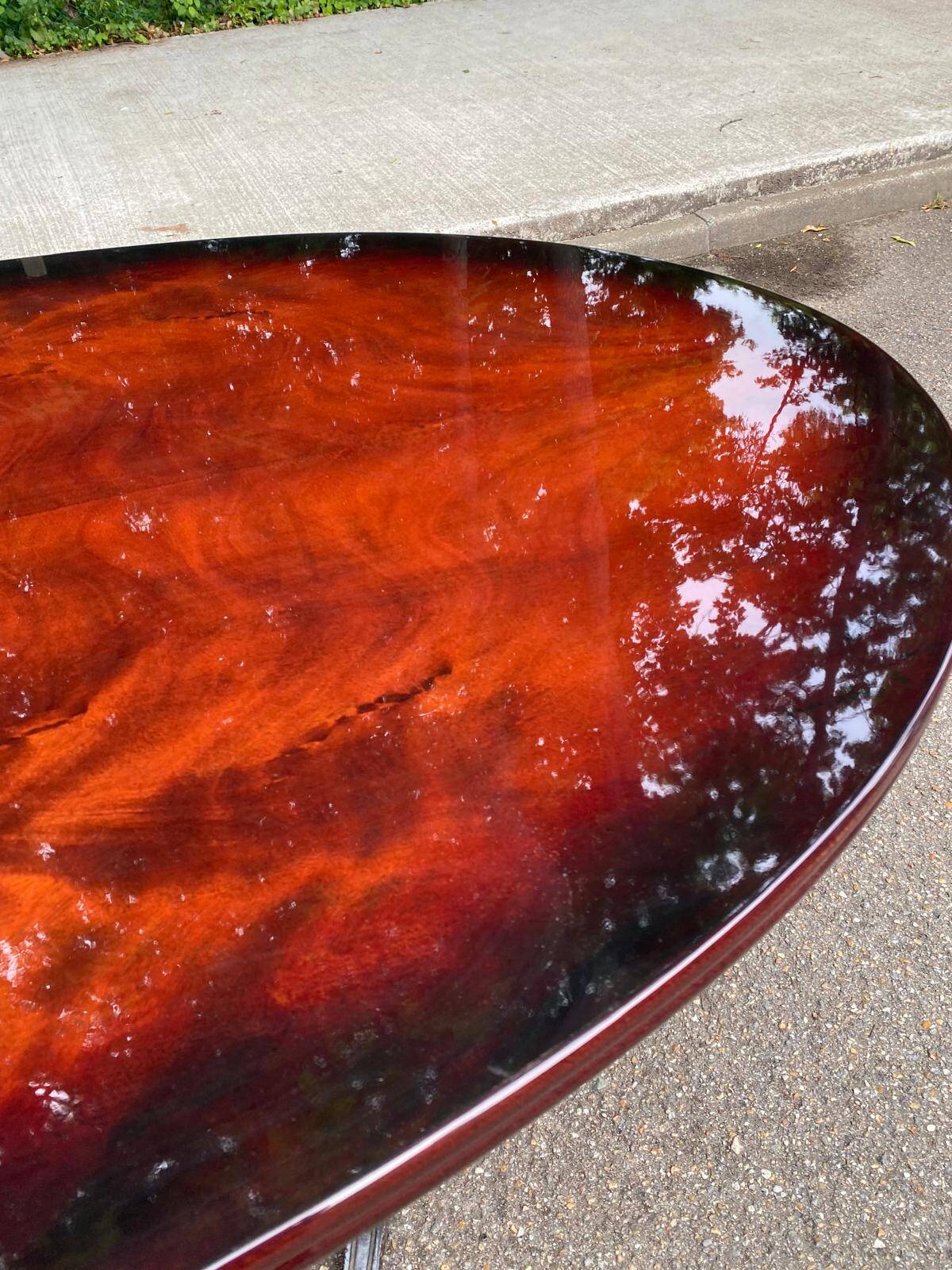 Glossy mahogany dining table in English Regency style from the 1970s.