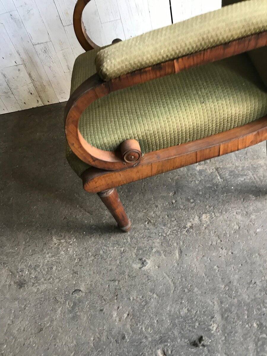 Biedermeier armchair in olive green fabric and carved wood, period 1890-1919.