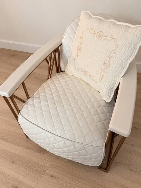 ENNIO armchair in quilted white leather with a copper stainless steel frame.