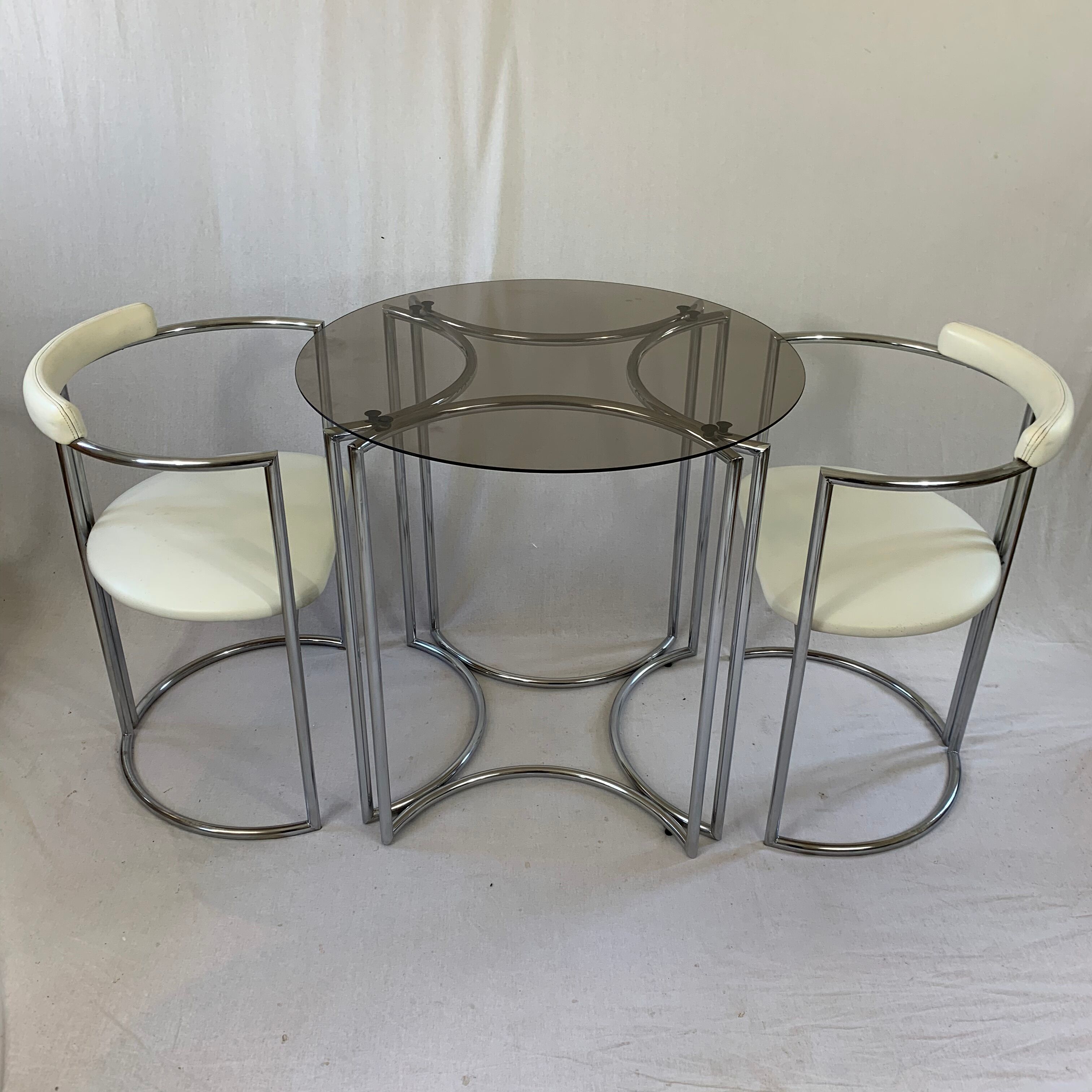 Chrome table and two modernist chairs