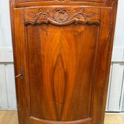 Corner cabinet in walnut in the Louis XV style.