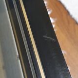 Black and gold coffee table with a double smoked glass top