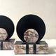 Art Deco bookends with a circular design in black and pink marble.