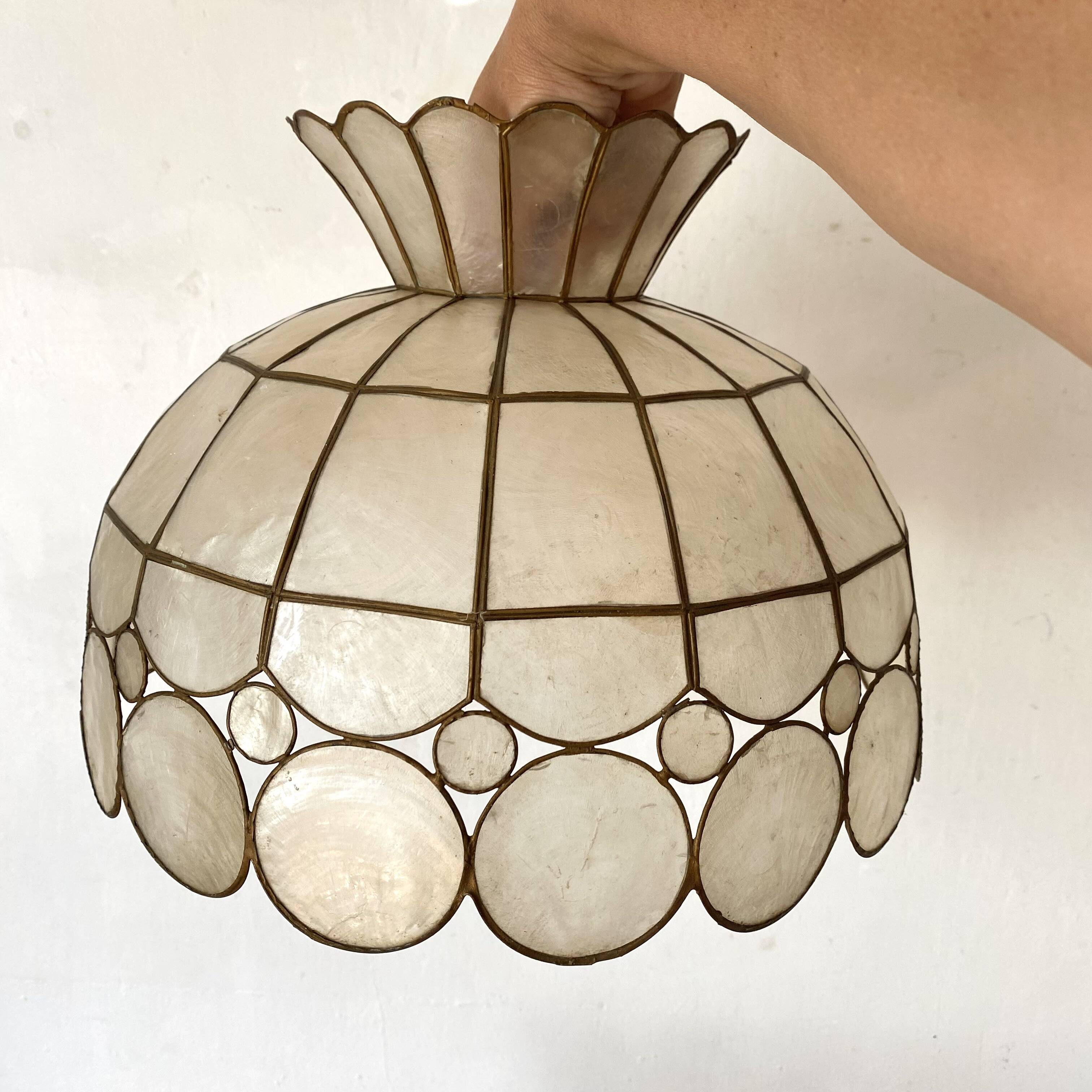 Pair of mother-of-pearl and brass pendants