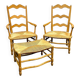 Pair of French Provencal Radassier beech chairs and ottoman, with rush seating.