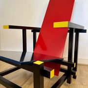 Red and Blue Chair in the Style of Gerrit Rietveld – De Stijl Movement