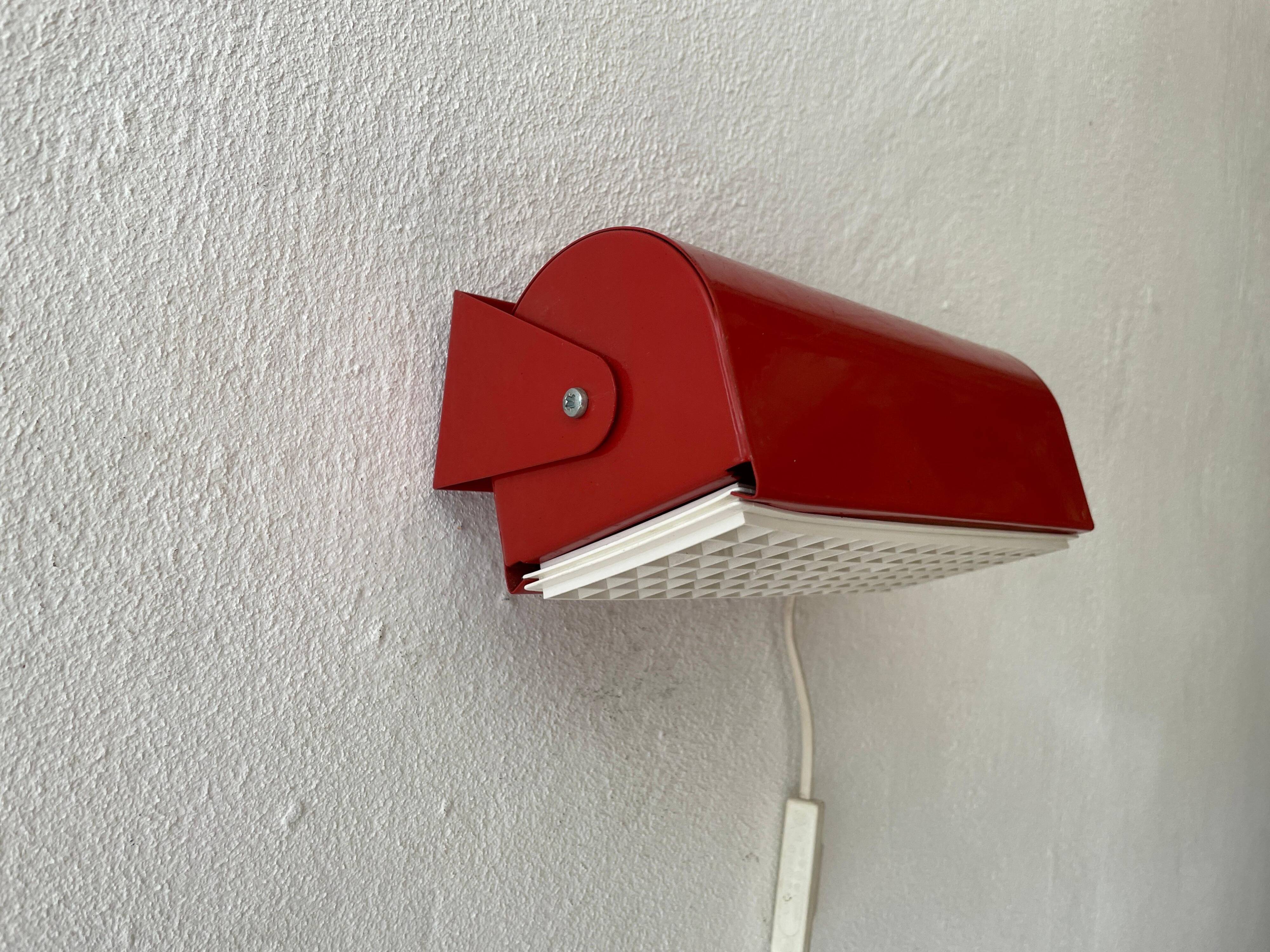 Simple red metal wall light from the AGE, 1970s, Germany.