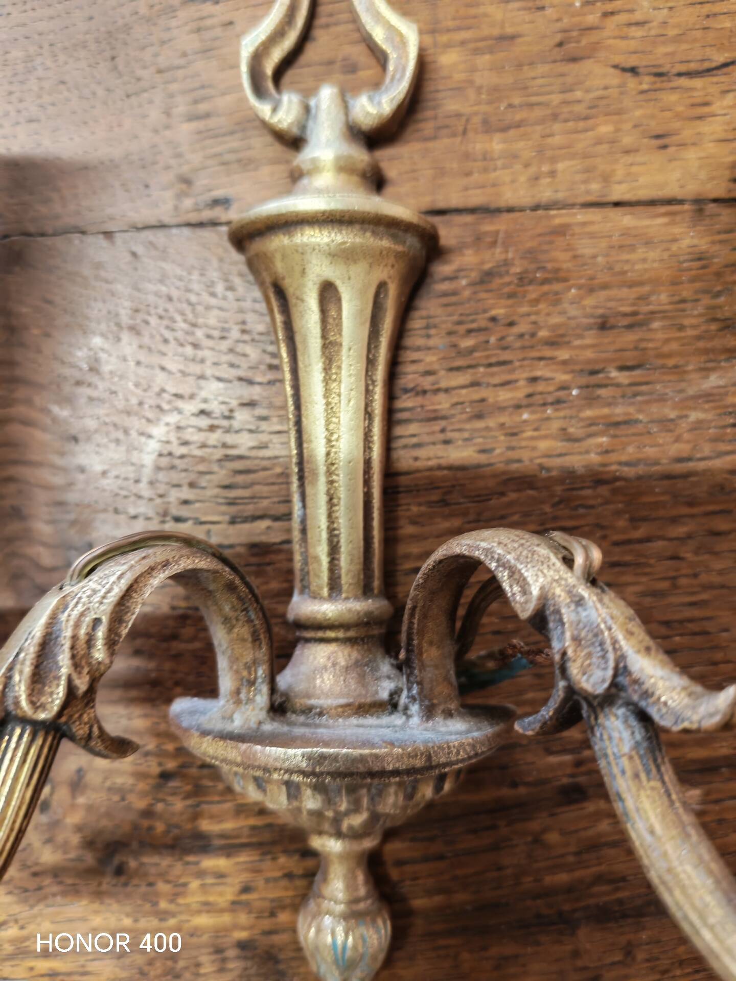 Two antique wall sconces in gilded bronze in the Louis XVI style.