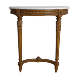 Half-moon console in Louis XVI style made of carved wood.