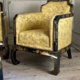 A set of two armchairs, a sofa and two poufs in lacquered wood with gilded chinoiserie decoration.